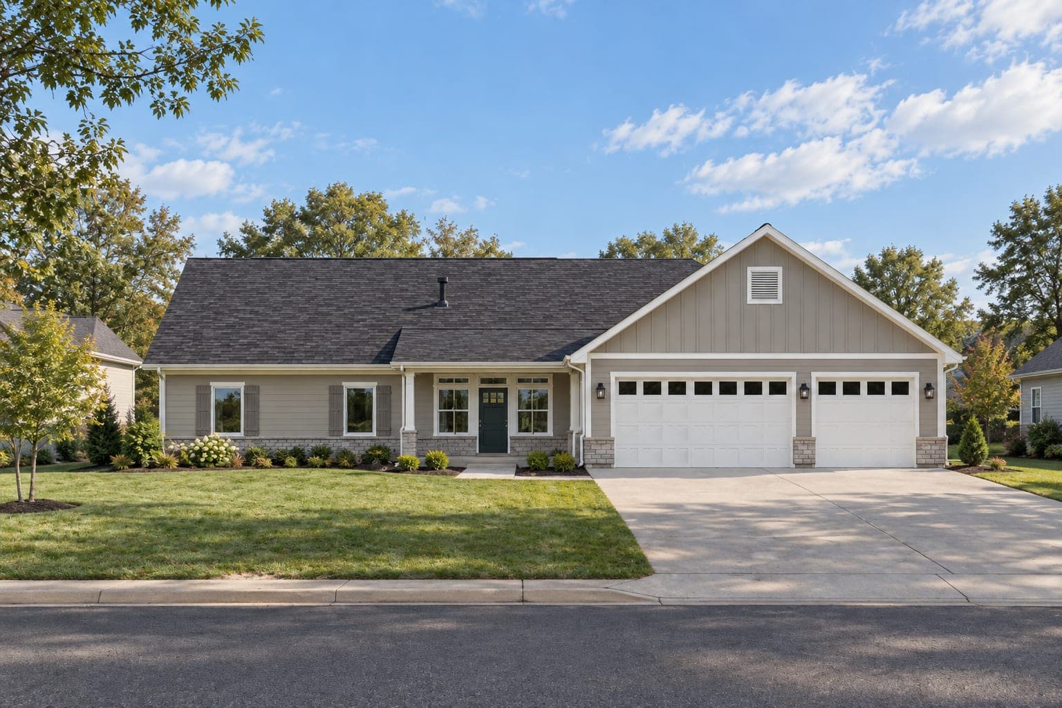 Front of a greige ranch with gray shutters, stone wainscot, a covered entry and a three-car garage under a board-and-batten gable